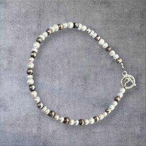 Rice pearl bracelet with gold & silver tone spacers plu a silver plated toggle